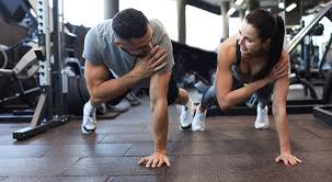 Toning Bingo Wings: Your Ultimate Guide to Sculpting Sleek Arms at the Gym 3 Fitness trainer demonstrating arm toning exercises Doncaster