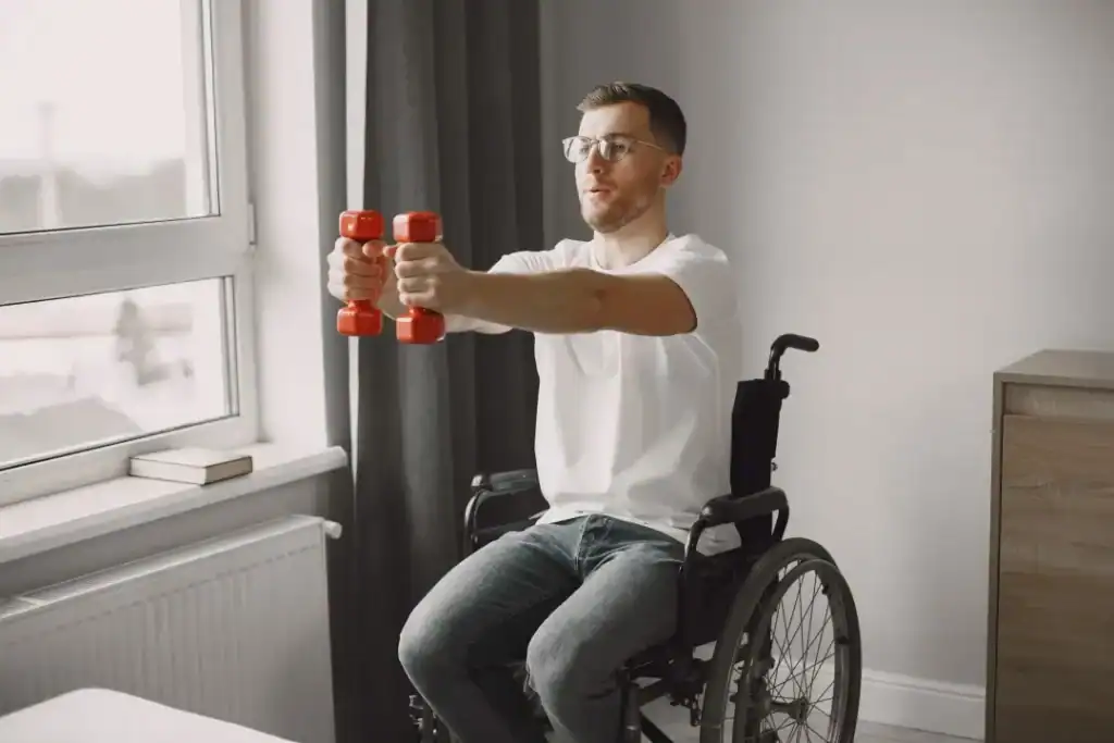 Image of man doing exercise in his wheelchair to aid weight loss Doncaster